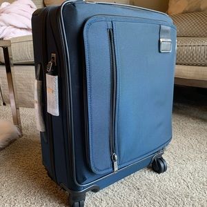 TUMI BRAND NEW navy suitcase